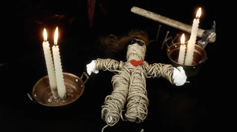 Voodoo doll candles hammer nails static Stock Footage 55288136