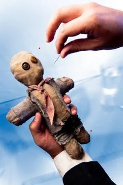 Voodoo doll getting pierced Stock Photos