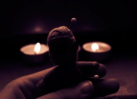 Voodoo doll in hand Stock Photos