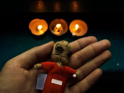 Voodoo doll in hand Stock Photos
