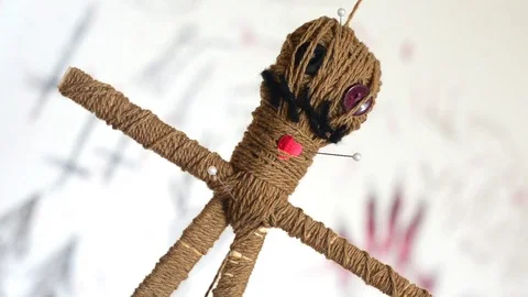 Voodoo doll turns round slowly on white background with creepy ritual symbols Stock Footage 114893310