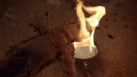 Voodoo Dooll Over the Fire Stock Footage 344038222