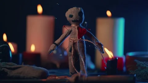 Voodoo Magic concept. Witchcraft with rag doll. Close-up of puppet nipped with Stock Footage 160227637