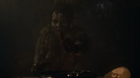 Voodoo witch cutting her palm to put blood into the spiritual mixture Stock Footage 259861411