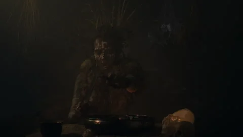 Voodoo witch cutting her palm to put blood into the mixture Stock-Footage 259861905