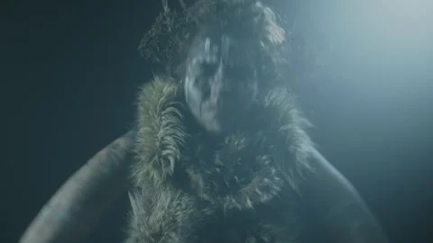 A voodoo witch performing a ritual dance under the spotlight Video stock 259859525