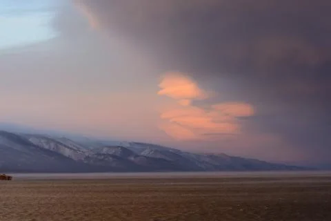 Vortex clouds at sunset on the lake Baikal Stock Photos