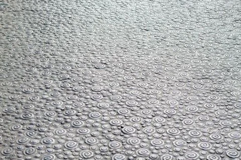Vortex pattern on corrugated metal surface. Stock Photos