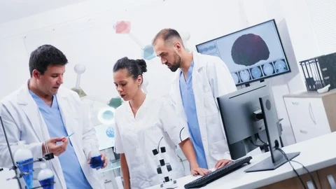 Vortex spinning shot of team of scientists in modern laboratory Stock Footage 114560703