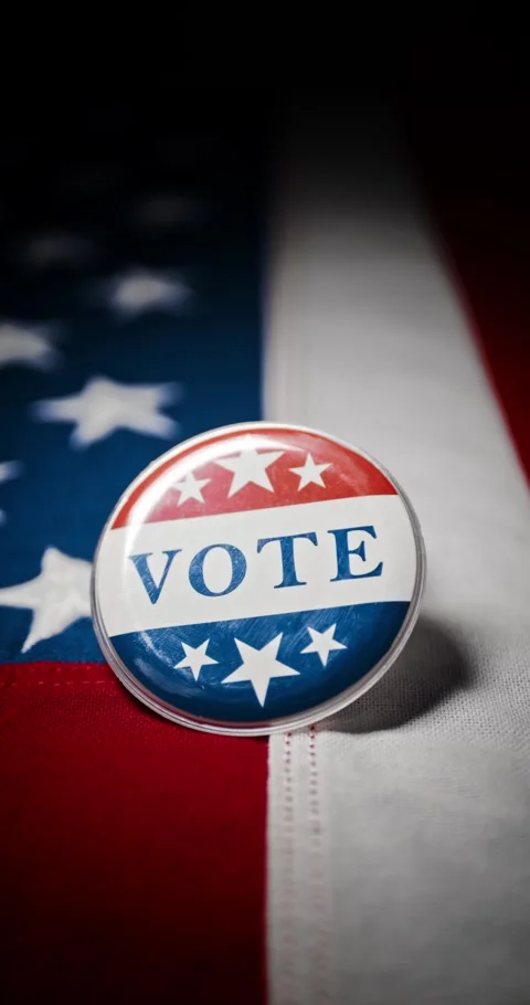 Vote button pin, in the red white and blue of the United States America, pi.. Stock Footage 282467701