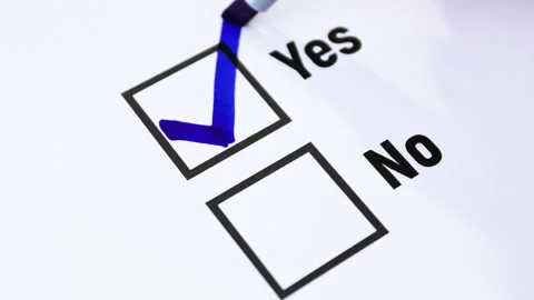 Vote, Hand using a blue marker to draw a check mark in the Yes box Stock Footage 328232469