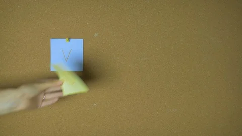 Vote. Hands pining sticky notes on pin board funny animation Stock Footage 98523929