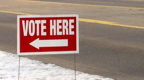 'Vote Here' sign in the snow. Stock Footage 10800152