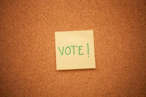 Vote note on cork board Stock Photos