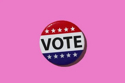 Vote pin on pink background Stock Photos