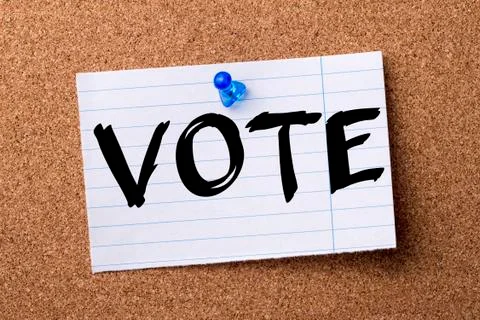 VOTE - teared note paper  pinned on bulletin board Stock Photos