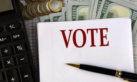 VOTE - word on a white sheet on the background of a calculator, coins and dol Stock Photos