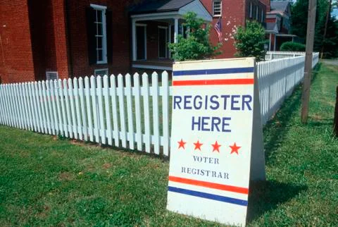 Voter registration sign with white picket fence, Buckingham, Virginia Stock Photos