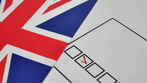 Voter ticks box next to their candidate on paper ballot with red marker Stock Footage 344169959