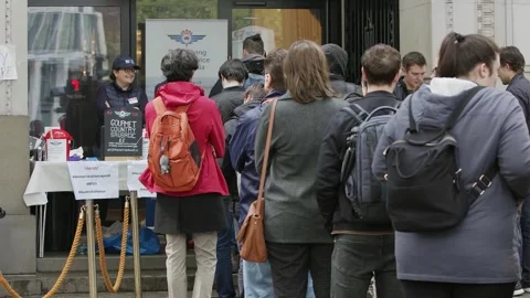 Voters queue at a desk inside Australia House Video stock 345298888
