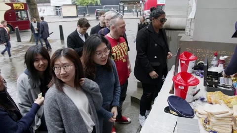 Voters queue past a stall outside Australia House in London Video stock 345298805