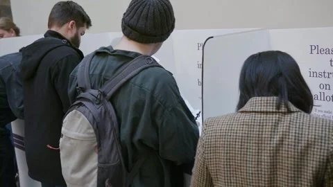 Voters queue at the voting booths during overseas voting Video stock 345299050