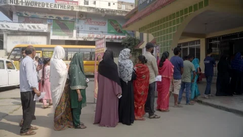 Voters standing in queue during the Bihar Assembly election Stock Footage 322894116