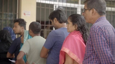 Voters standing in queue during the Bihar Assembly election Stock Footage 322894632