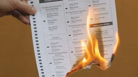 A voting ballot marked with Hillary Clinton is burnt by an angry voter Video stock 67430088