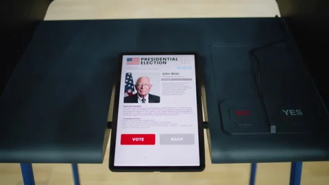Voting booth with tablet computer with displayed information about US Stock Footage 273843569