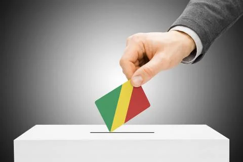 Voting concept - male inserting flag into ballot box - republic of the congo Stock Photos