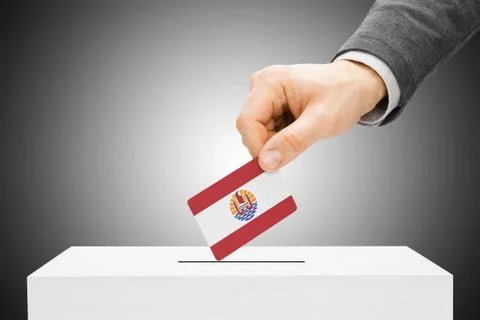 Voting concept - male inserting flag into ballot box - french polynesia 写真素材