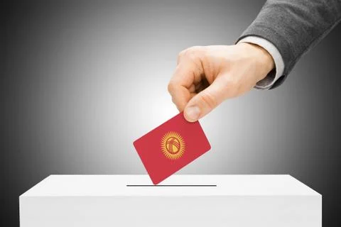 Voting concept - male inserting flag into ballot box - kyrgyzstan 写真素材