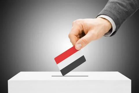 Voting concept - male inserting flag into ballot box - yemen 스톡 사진