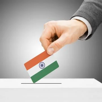 Voting concept - Male inserting flag into ballot box - India Stock Photos