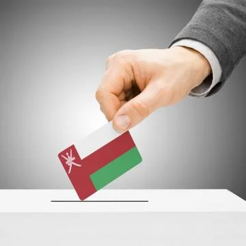 Voting concept - Male inserting flag into ballot box - Oman 스톡 사진