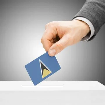 Voting concept - Male inserting flag into ballot box - Saint Lucia Фото