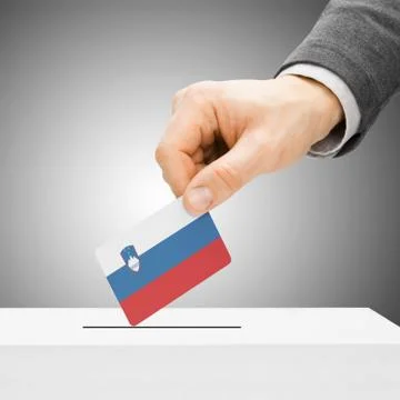 Voting concept - Male inserting flag into ballot box - Slovenia Stock Photos