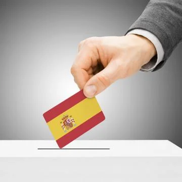 Voting concept - Male inserting flag into ballot box - Spain Foto stock