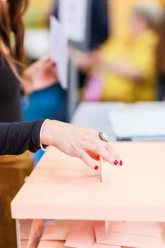 Voting democracy background. Unrecognizable hispanic woman hand in candidate Stock Photos