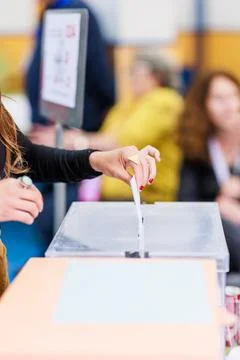 Voting democracy background. Unrecognizable hispanic woman hand in candidate Stock Photos