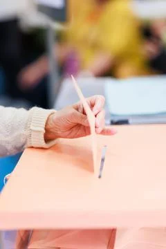 Voting democracy background. Unrecognizable hispanic woman hand in candidate Stock Photos