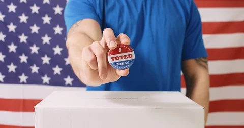 Voting hand on American flag Stock Footage 127643421