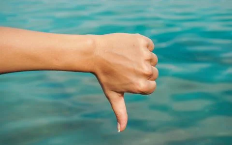 Voting hand on blue background Stock Photos