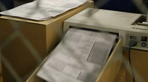 Voting machine being fed Stock Footage 12487942
