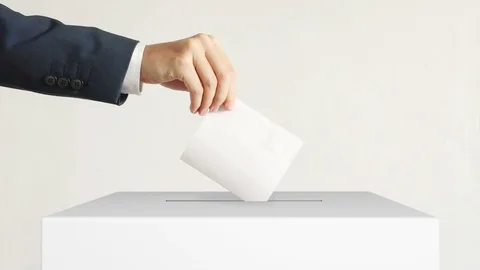 Voting. Man putting a ballot into a voting box. Stock-Footage 110777111