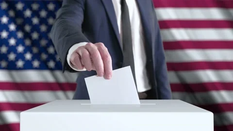 Voting. Man Putting a Ballot into a Voting Box with USA Flag on Background. Stock Footage 172441545