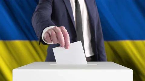 Voting. Man Putting a Ballot into a Voting Box with Ukrainian Flag Stock Footage 173603454