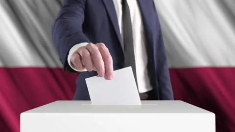 Voting. Man Putting a Ballot into a Voting Box with Poland Flag on Background. Video stock 176273559