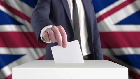 Voting. Man Putting a Ballot into a Voting Box with British Flag on Background. Stock Footage 176874163